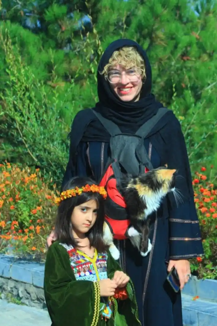 Woman with cat in Afghanistan receiving warm welcome from locals